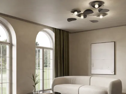 Lampada da parete con disco metallico che ricorda le foglie di un albero portate dal vento Flow Ceiling di Kundalini