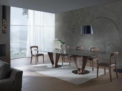 Tavolo rettangolare con top in vetro e basamento in legno massello e metallo Mobius di Pacini e Cappellini